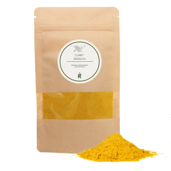 Das Bild zeigt einen Haufen Curry indisch vor einer Verpackung.